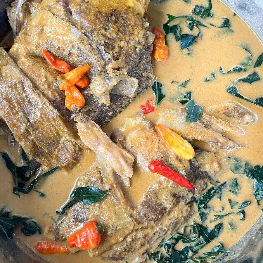Gulai kepala ikan simmered with cassava leaves and bird’s-eye chilli