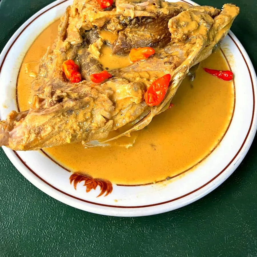 Gulai kepala kakap served on a plate